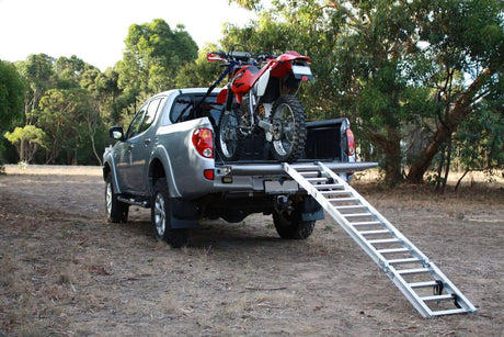 motorcycle loaded on a ute with ramp