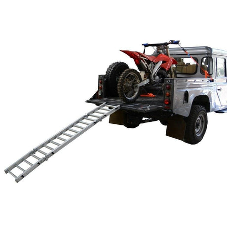 motorcycle ramp on white ute with red dirtbike