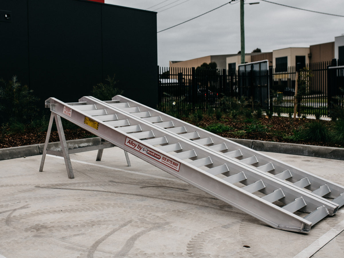 AusRamp 8-tonne aluminium loading ramps, pair set up on a stand