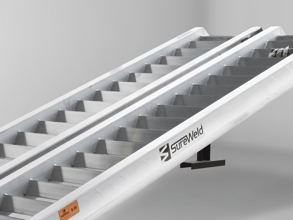 Close-up of the raised rungs on a Sureweld Track Series ramp, built for steel tracks