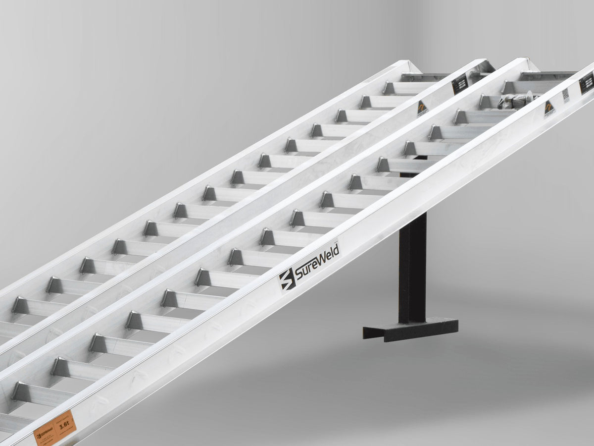 Close-up of the raised rungs on a Sureweld Track Series ramp, built for steel tracks