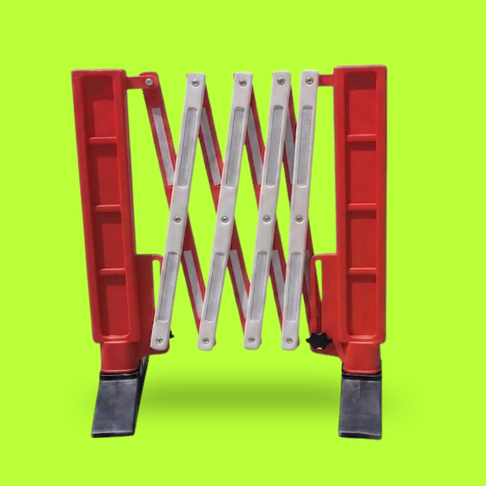 Red and white adjustable barricade on a green background