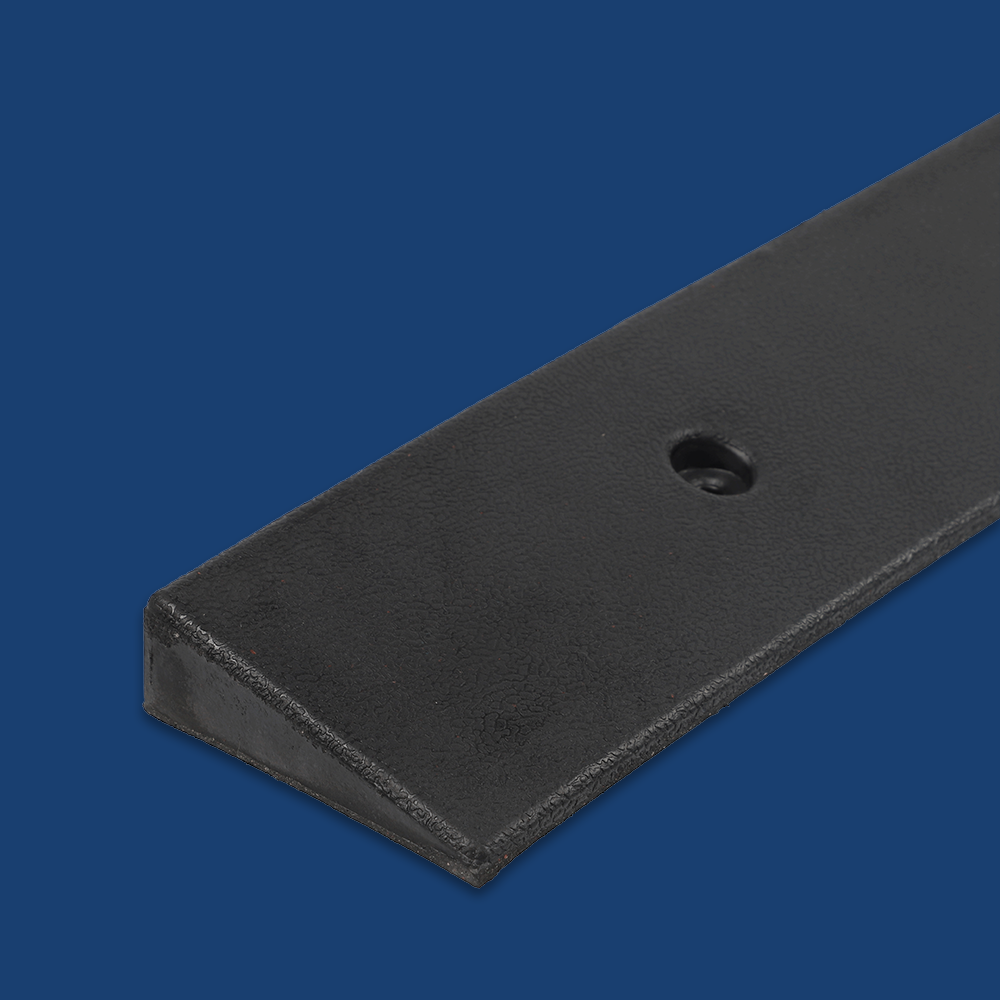 Close-up corner detail of the ramp, set against a dark blue background.