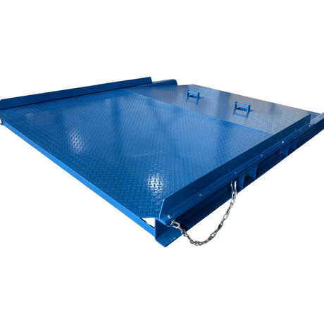Angled view of a heavy-duty blue steel dock plate with safety chain and textured surface.