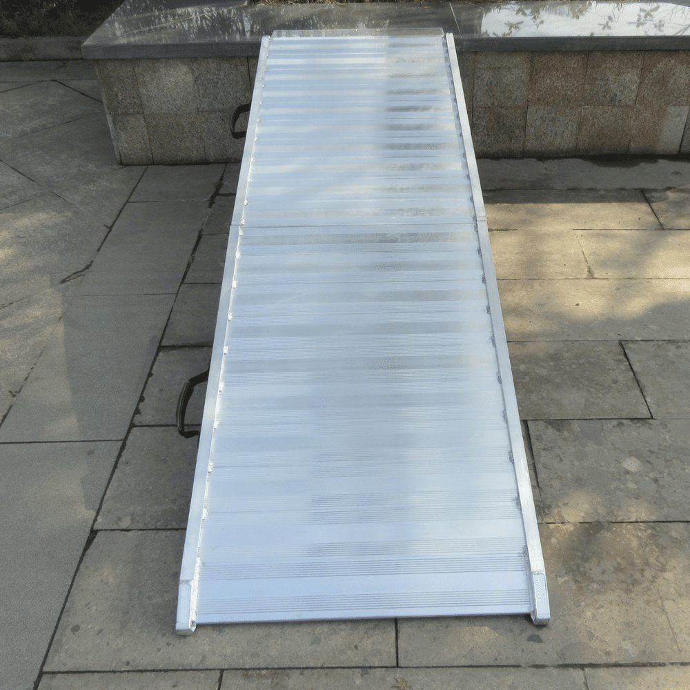 Aluminium ramp placed on tiled ground ready for use.