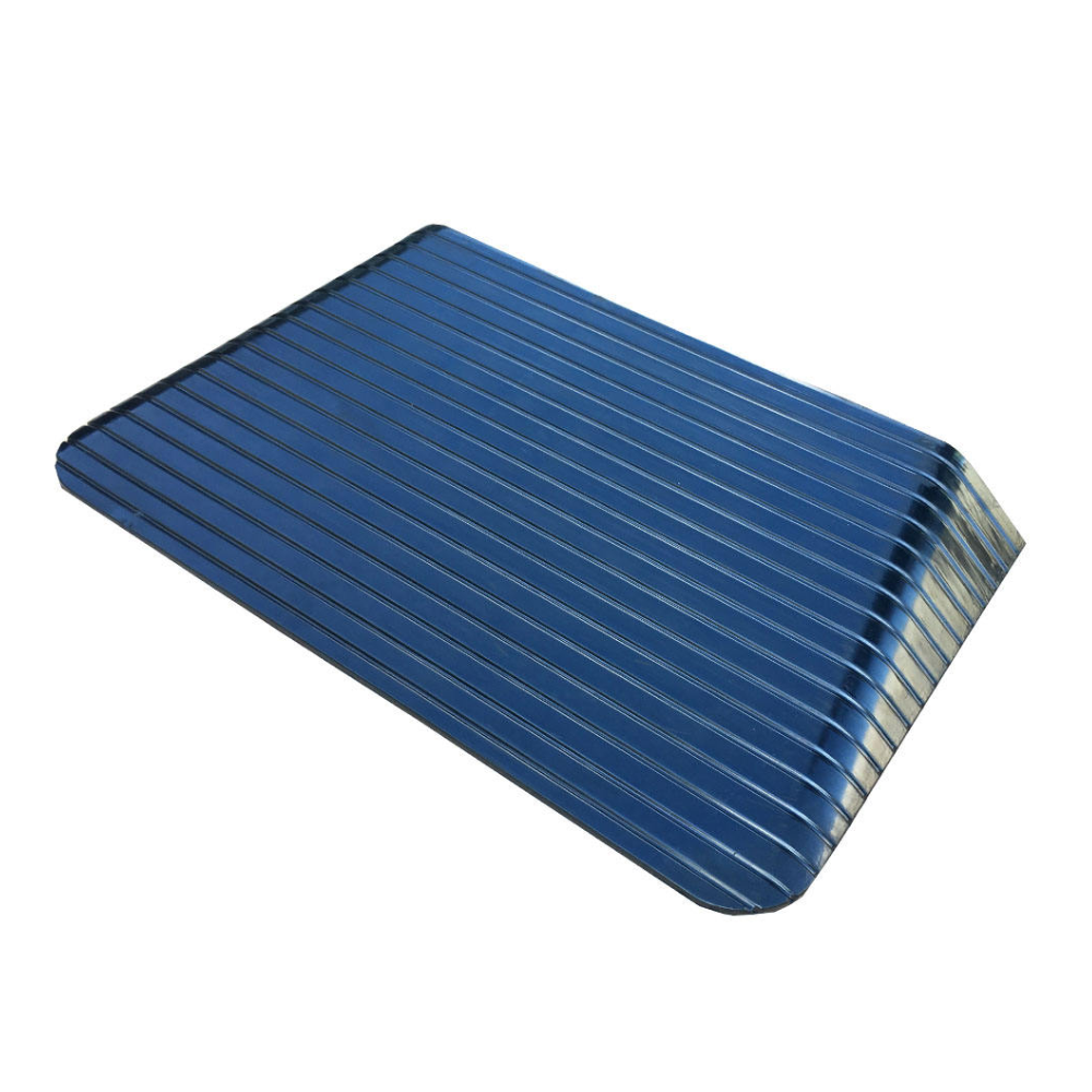 Black rectangular rubber ramp with ribbed texture on a white background