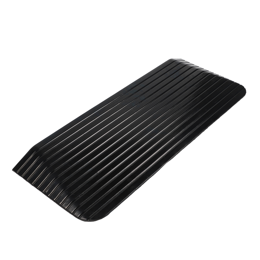 Black rubber ramp with ribbed texture on a white background