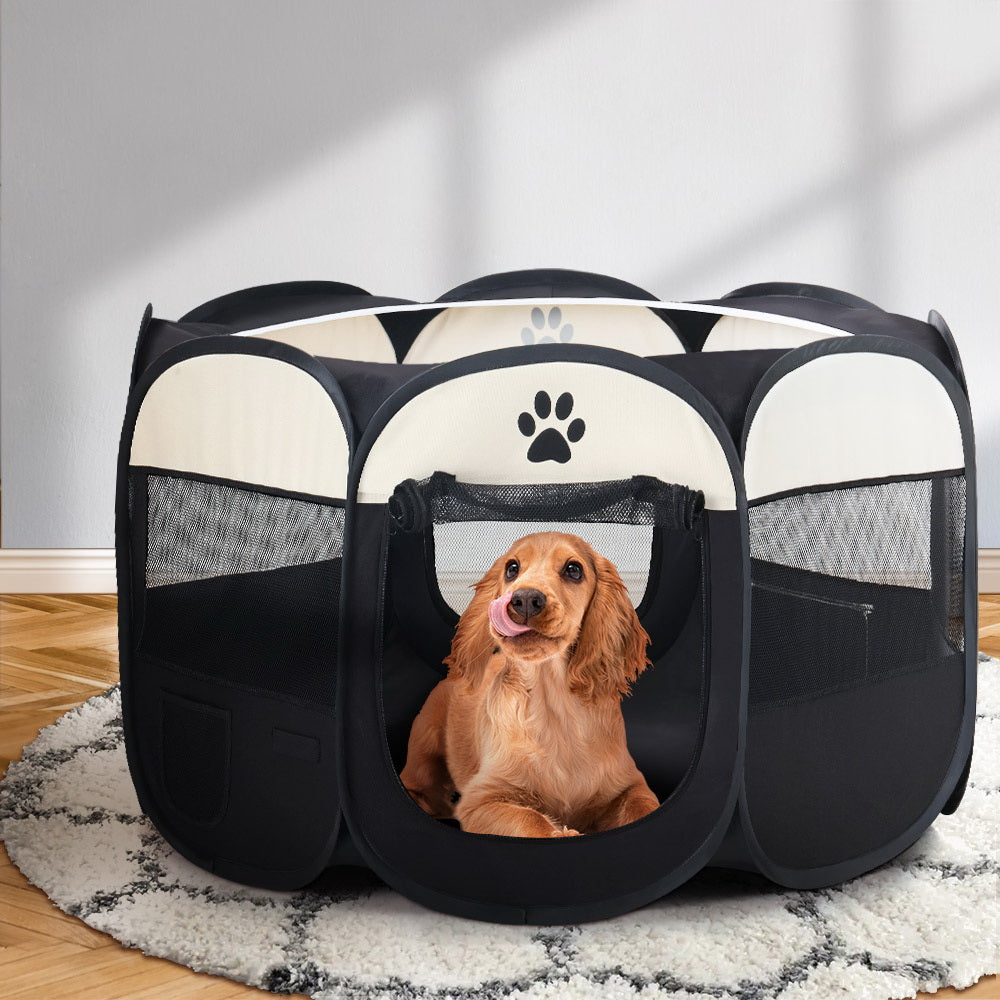 Black and white pet playpen with mesh windows and zippered entry door, angled front view.