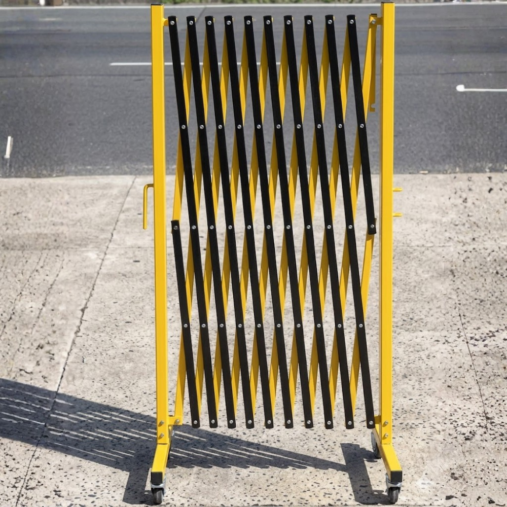 Yellow and black safety barrier on a road