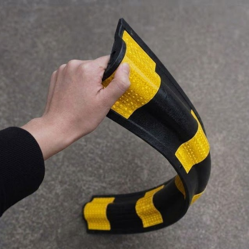 Bending of Base Guard Heavy Duty Rubber Corner Guard on cement floor Background