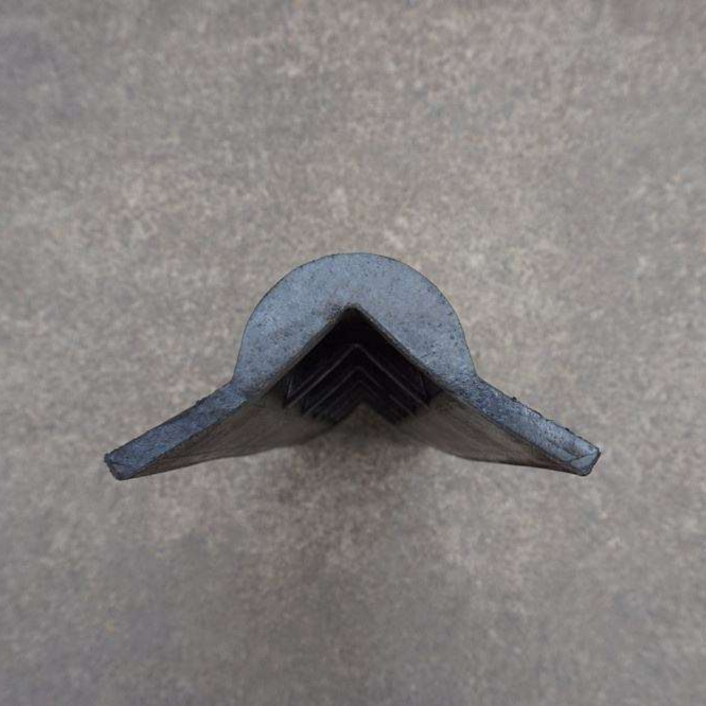 Side view of Base Guard Heavy Duty Rubber Corner Guard on cement floor Background