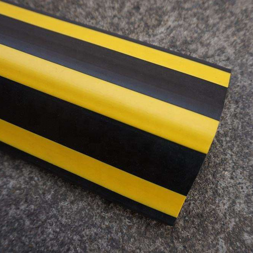 Close up shot of Base Guard Stainless Steel Reinforced Rubber Corner Guard on concrete surface