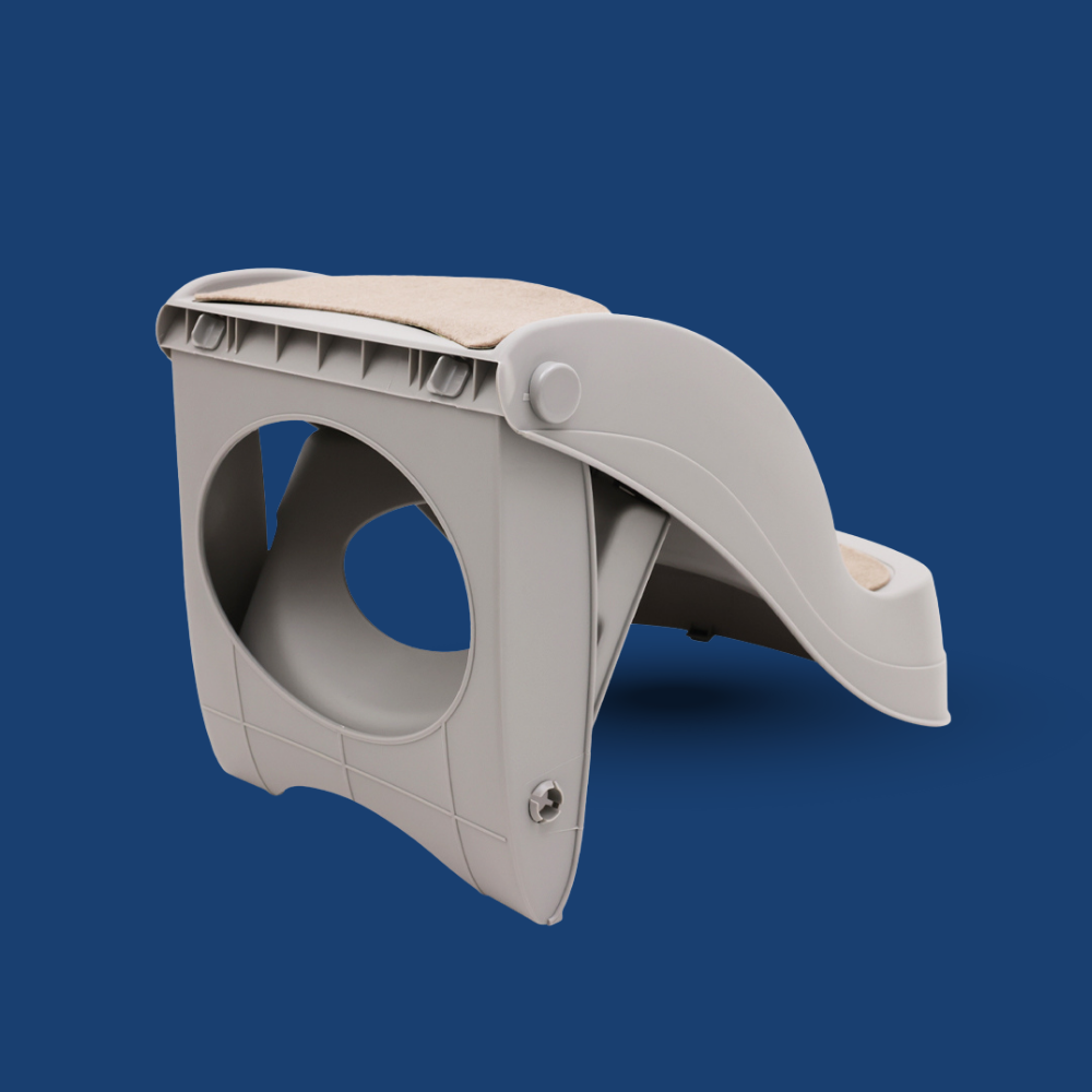 Gray plastic bracket or component on a blue background