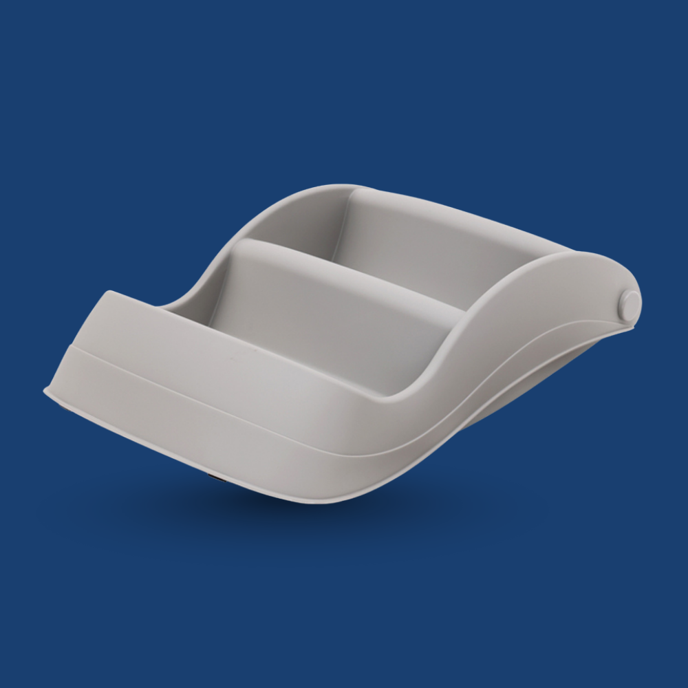 Gray plastic component on a blue background