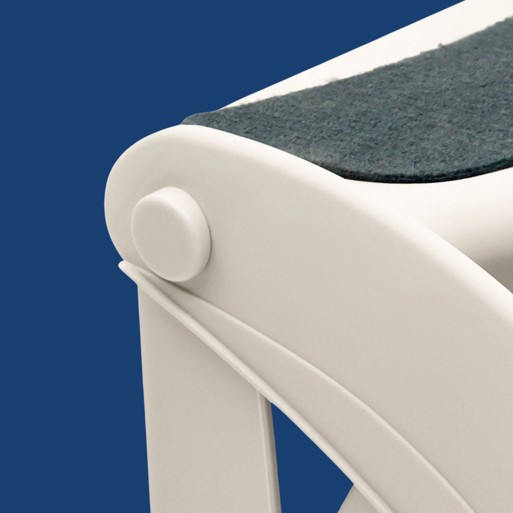 Close-up of a white chair with a dark cushion on a blue background