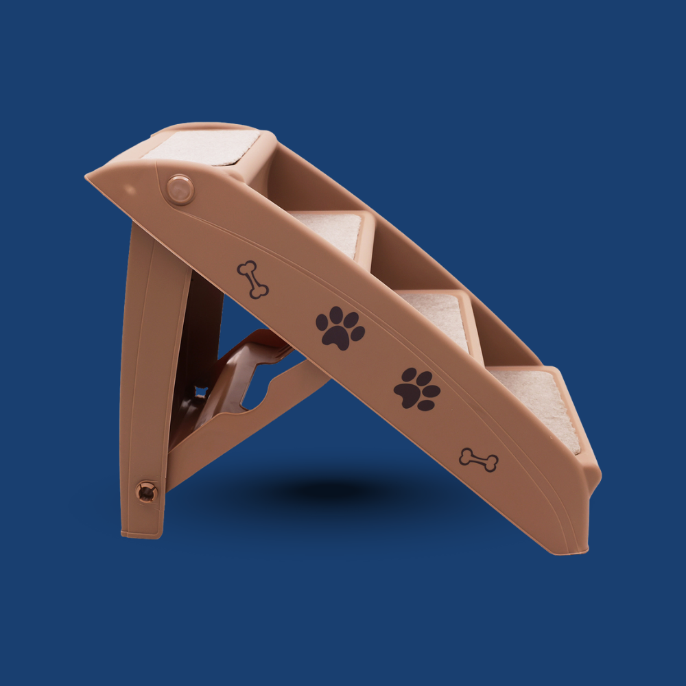 Brown pet ramp with paw and bone designs on a blue background