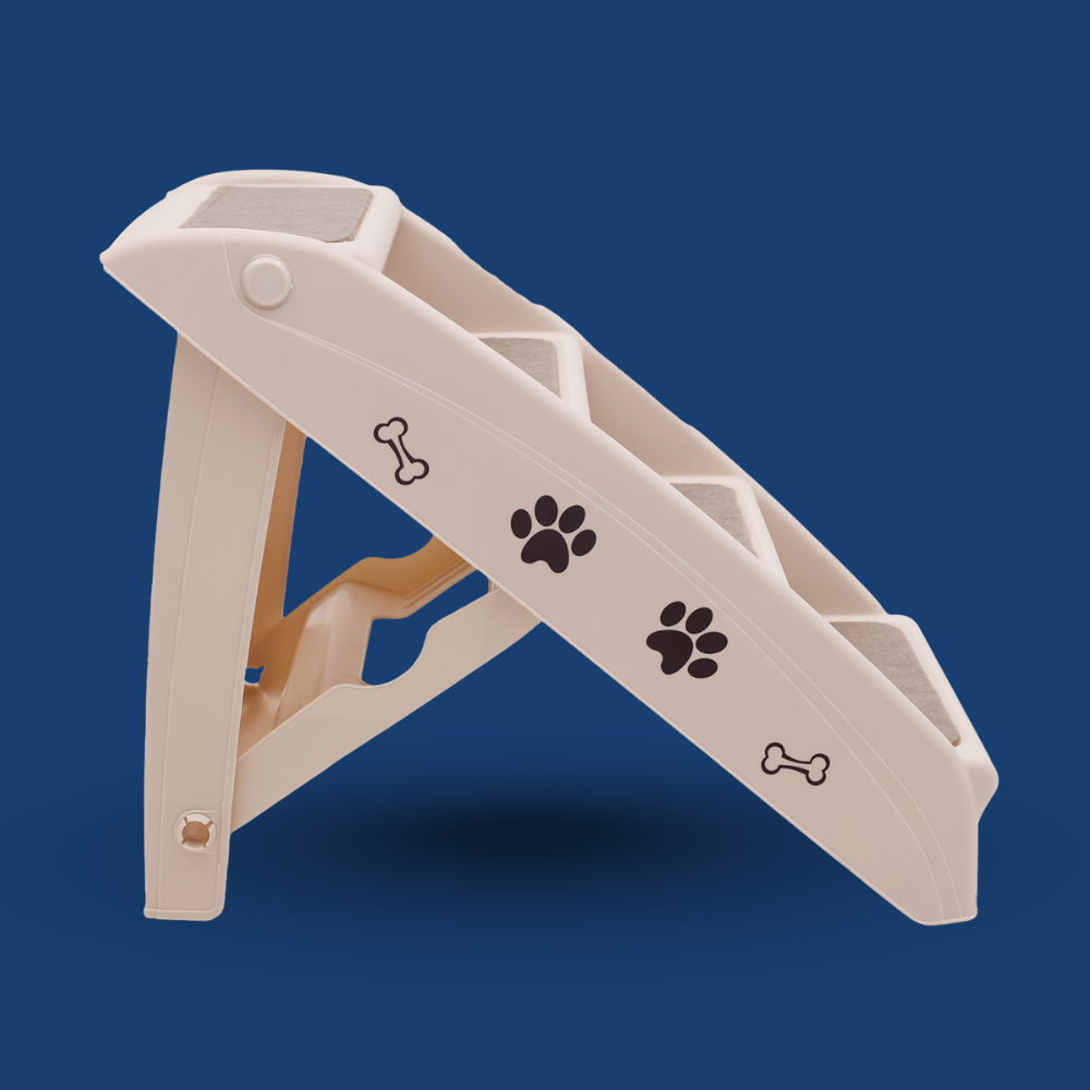 Beige pet ramp with paw and bone designs on a blue background