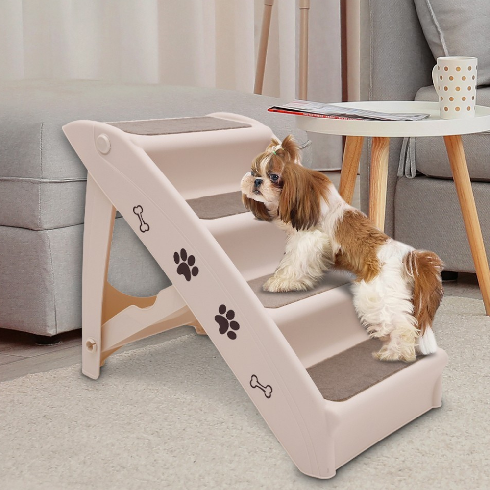 Dog using a set of pet steps in a living room setting