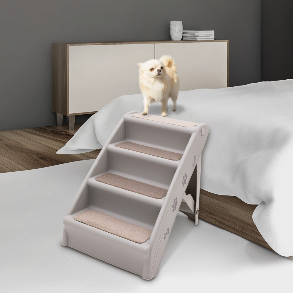 Dog standing on a set of pet stairs in a bedroom setting.