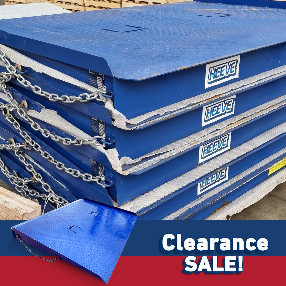 Close-up of blue stacked forklift container ramps, labelled with Heeve branding and placed on a warehouse floor with "Clearance Sale!