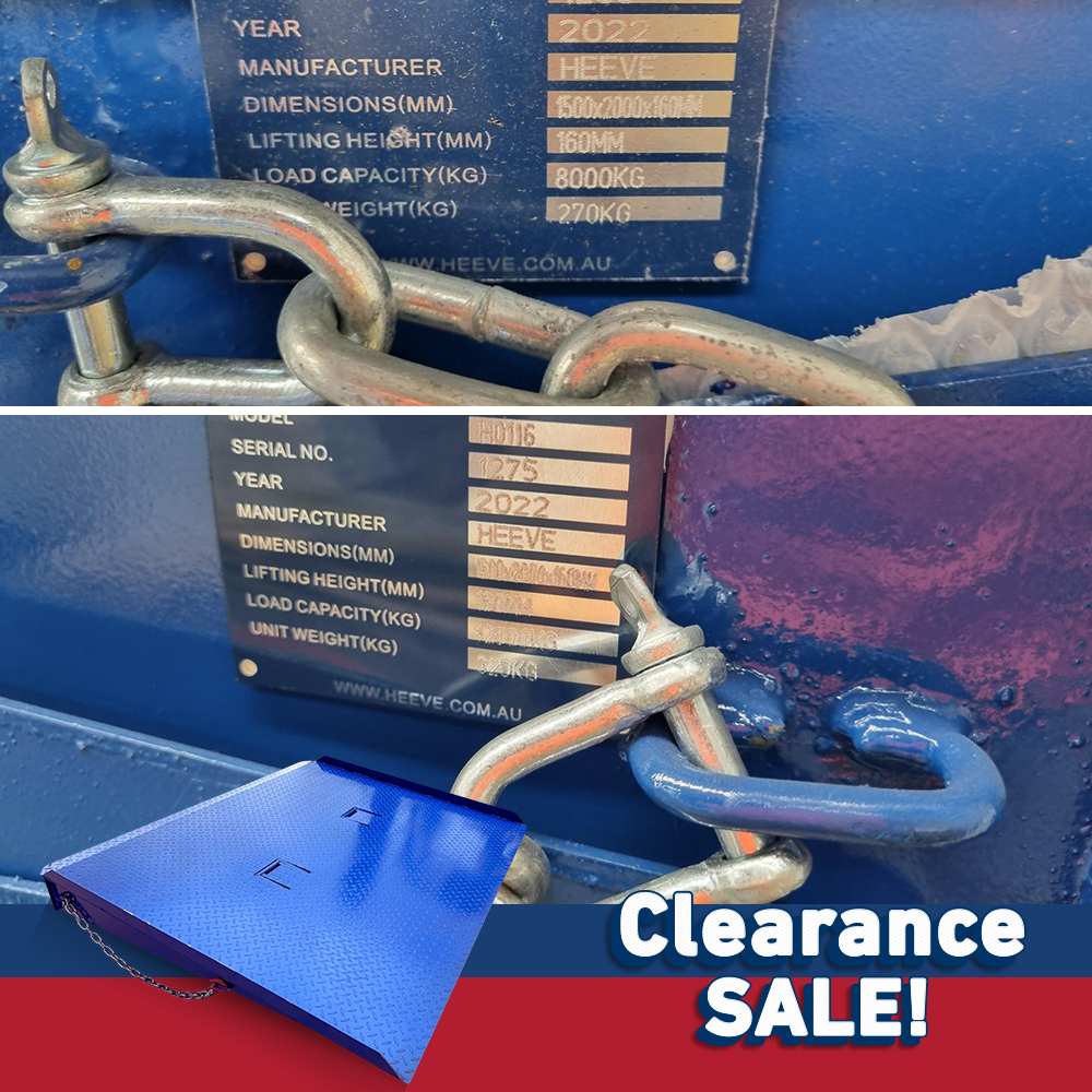 Close-up of product label on the blue container ramp showing manufacturer details, year, weight, and dimensions, with chains attached, and "Clearance Sale