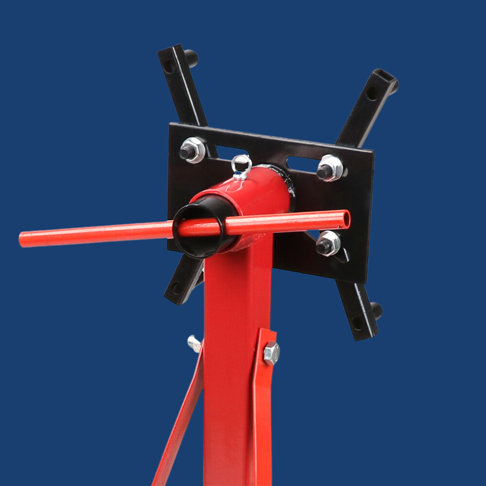 Red and black mechanical device on a blue background