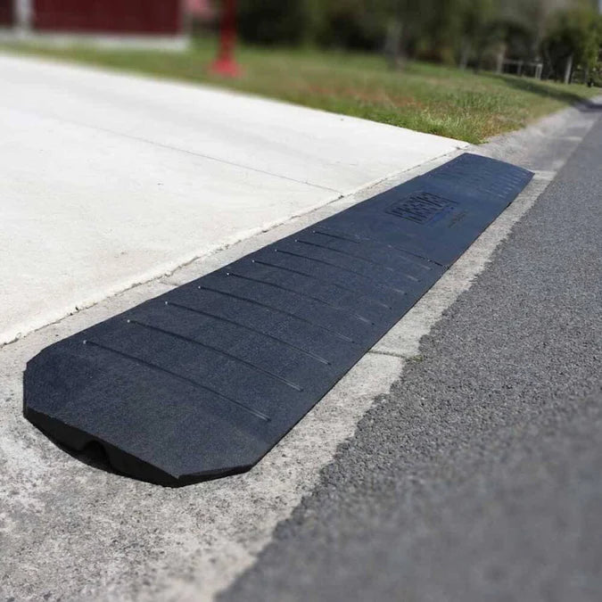 Full view of ramp installed at driveway edge.
