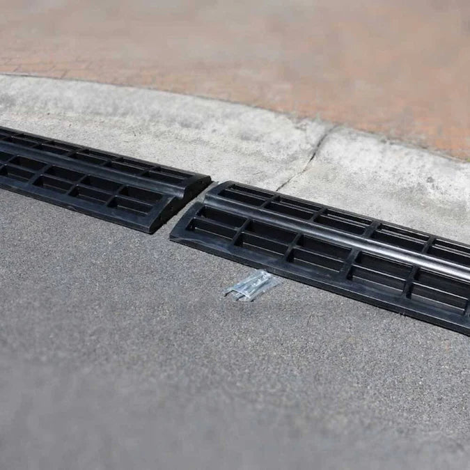 Ramp installed over kerb with black insert section.