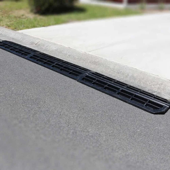 Narrow ramp profile viewed from side at kerb.