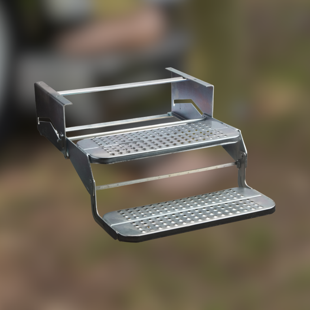 Metal step stool with textured platforms on a blurred natural background