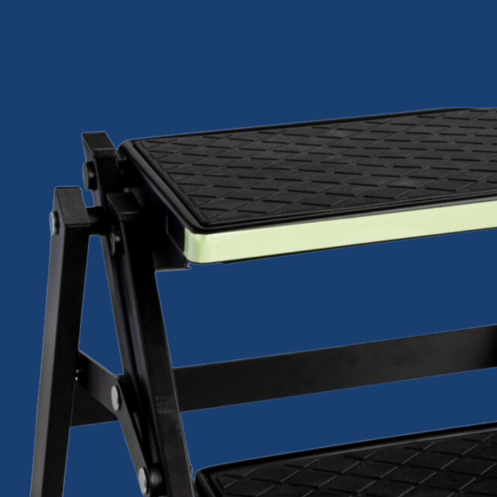 Black step stool with textured platform on a blue background
