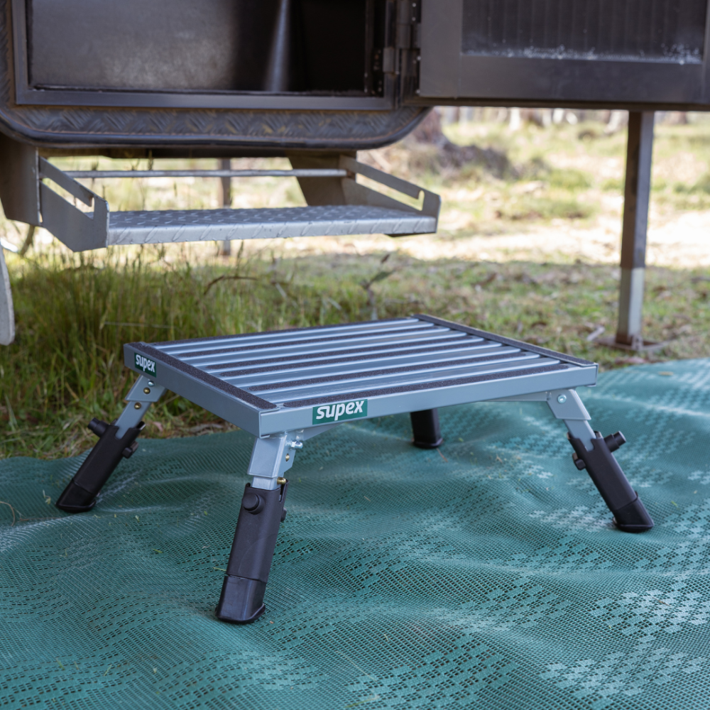 Supex portable step platform on a green mat outdoors