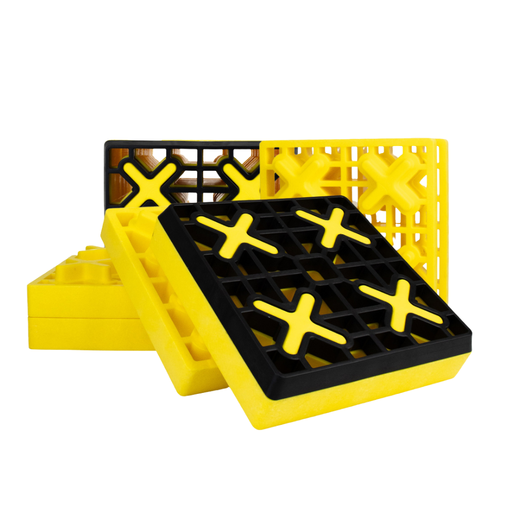 Yellow and black plastic ramps on a white background