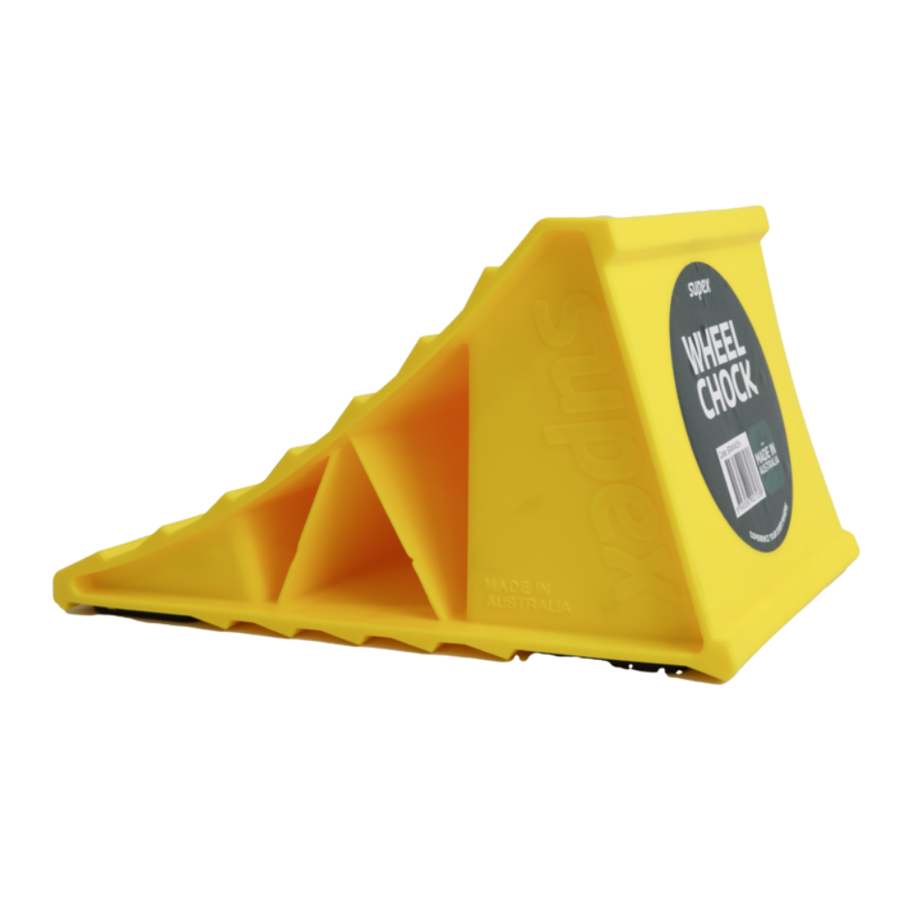 Yellow wheel chock with a label on a white background