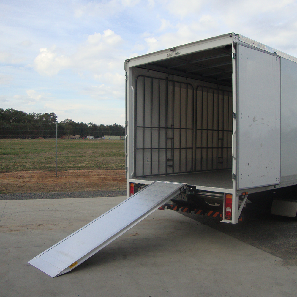 walk ramp on the rear of the truck on the concrete parking lot