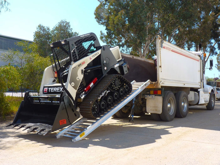 PT Series: all-surface rubber-track loaders like Posi-Track. Wide, close-set rungs that protect the tracks.
