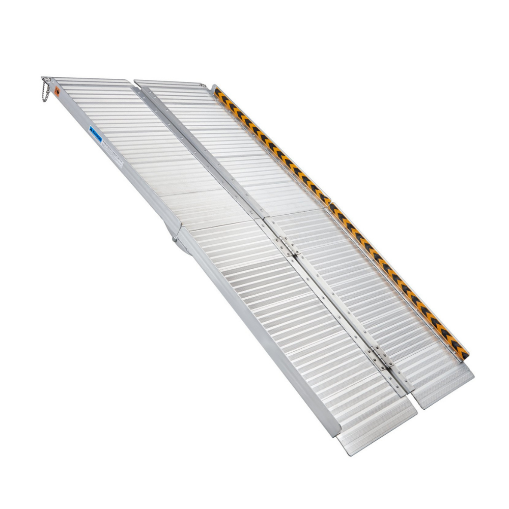 Angled full view of a long folding aluminium wheelchair ramp with raised edges and yellow caution tape on both sides.