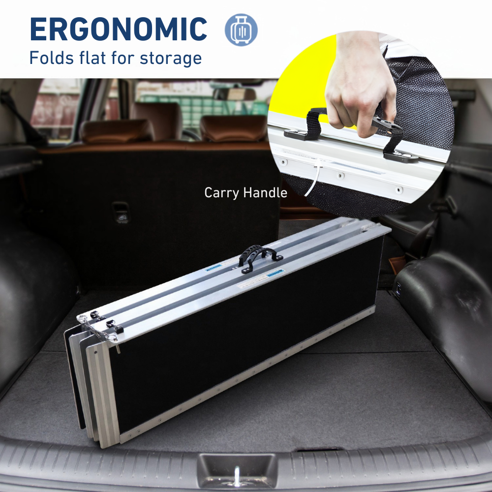 Person loading the ramp into a car boot, demonstrating ergonomic portability and compact fold design.