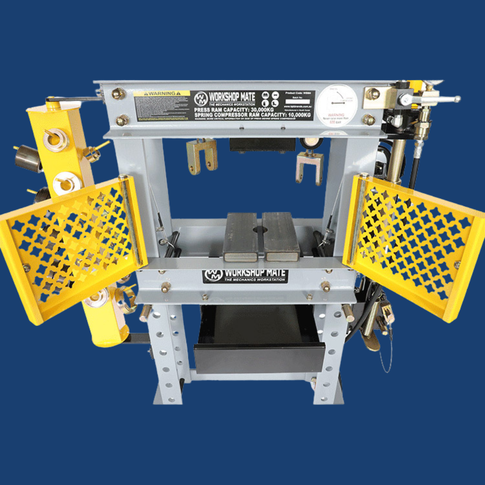 Close-up of the machine's side, showcasing multiple die holders with a vibrant yellow safety panel.