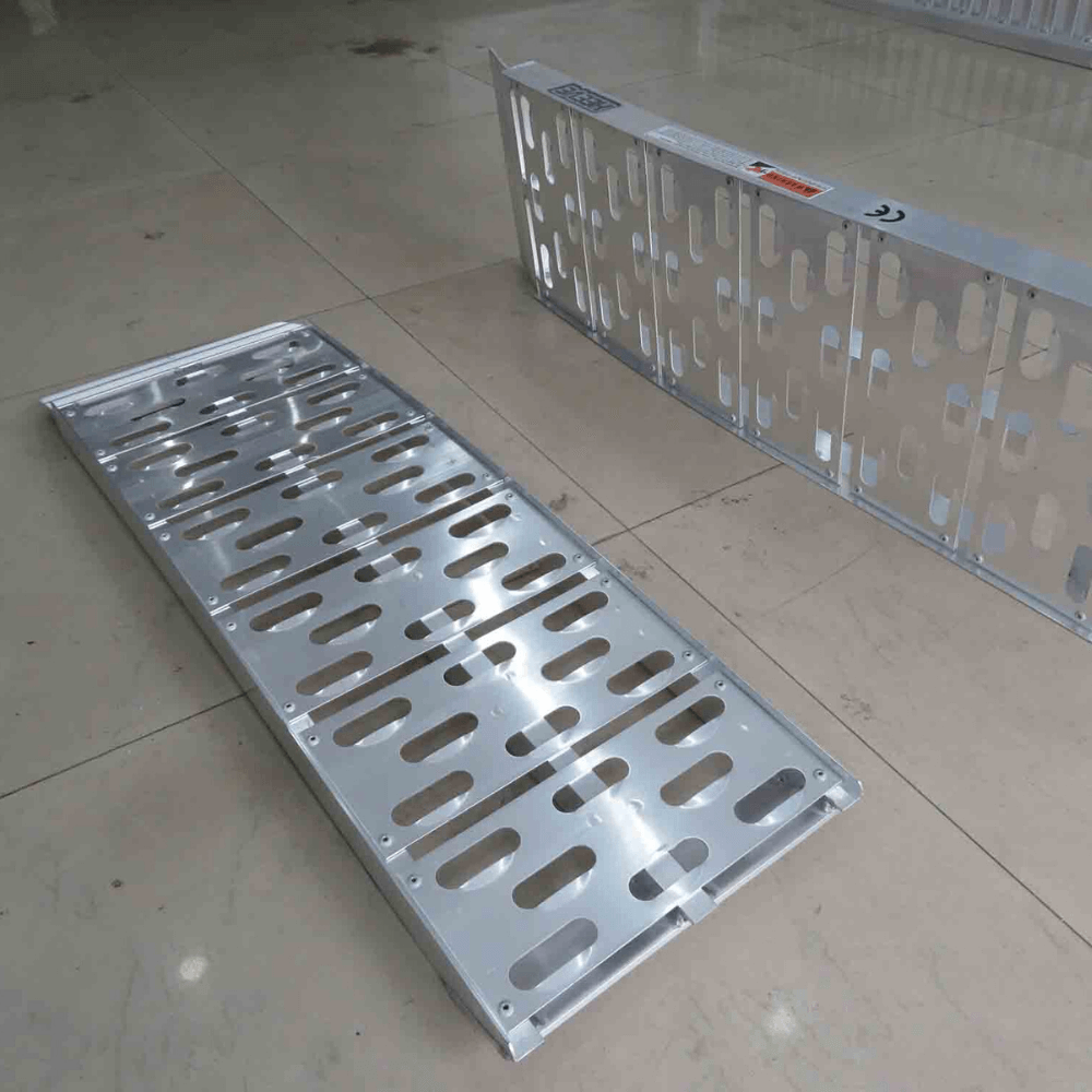 Two curved aluminium ramps, side-by-side on white.