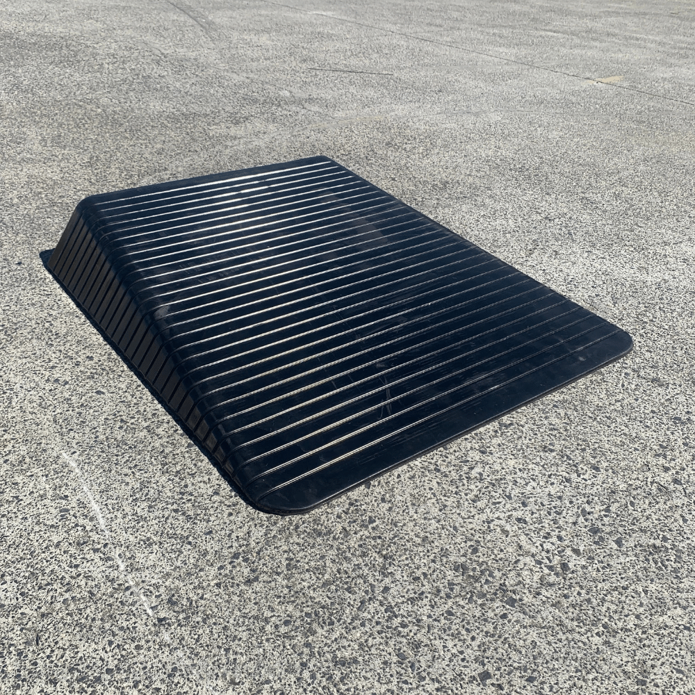 black rubber ramp on a concrete surface