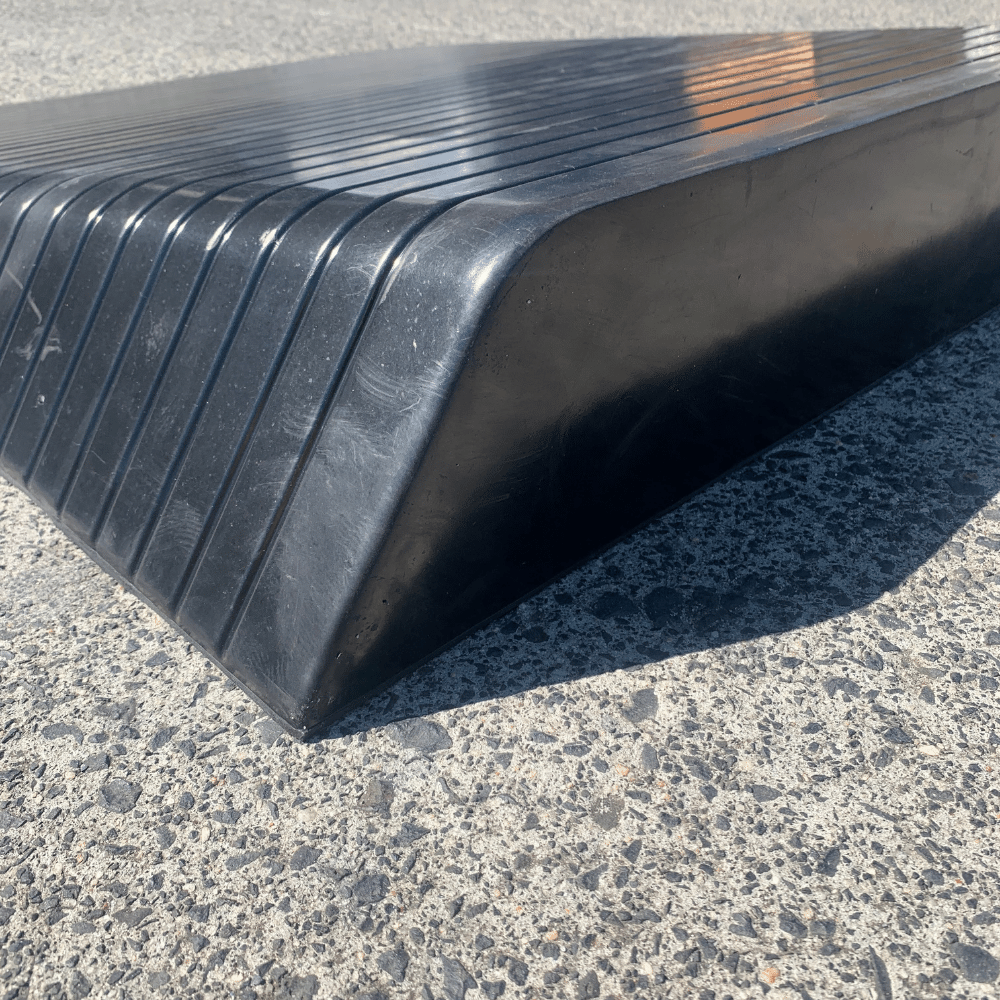 black rubber ramp on a concrete surface