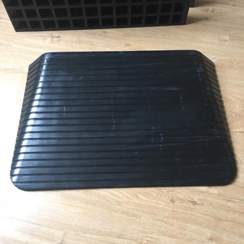 black rubber ramp top view on wooden planks