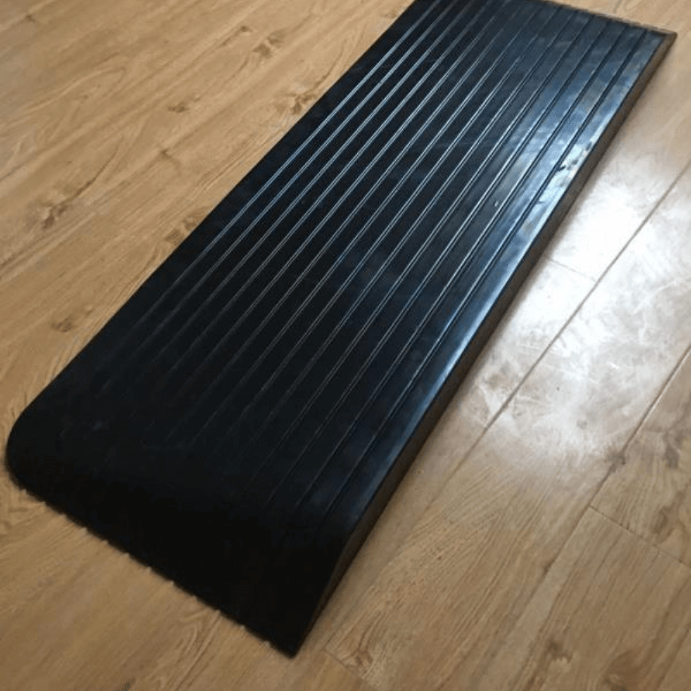 black rubber ramps on wooden planks