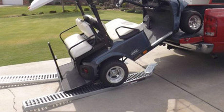 golf cart failed loading a ute ramps scattered on the ground