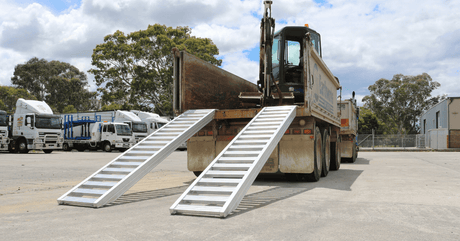 Aluminium loading ramps for excavator on the back of a truck