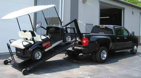 black golf cart loading a ute