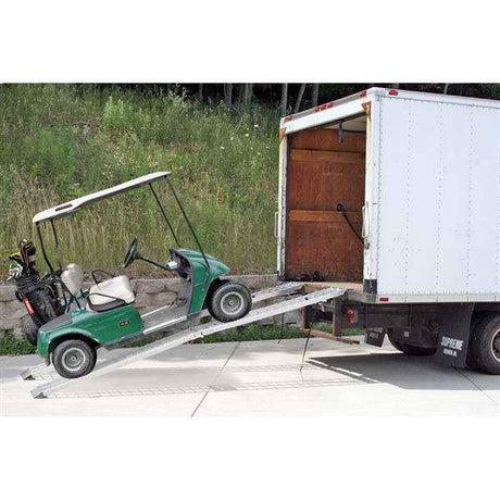 Green golf cat loading a truck