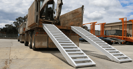 pair of loading ramps attached on a truck
