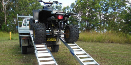 ATV loading a truck on a ramp
